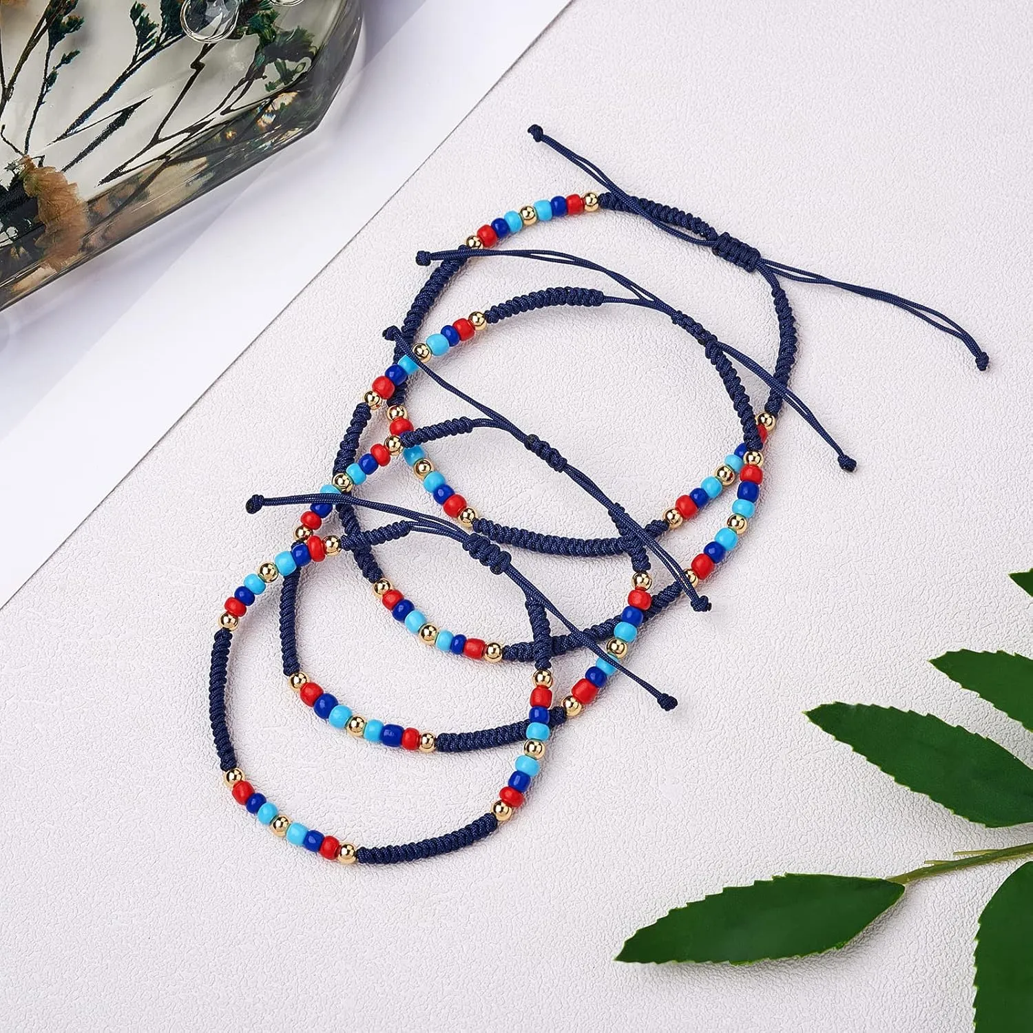 Ornaland 4Pcs Glass Seed Bead Braided Bracelets Anklets Set Adjustable Handmade Bracelet with Brass Beads Friendship Jewelry for Women Gift, Navy Blue